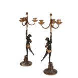 A PAIR OF ITALIAN CARVED, PAINTED AND PARCEL GILTWOOD AND COMPOSITION THREE LIGHT FIGURAL...