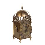 A VICTORIAN BRASS LANTERN STYLE STRIKING MANTEL CLOCK,