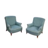 A PAIR OF VICTORIAN UPHOLSTERED ARMCHAIRS, IN THE MANNER OF HOWARD & SONS AND POSSIBLY BY...