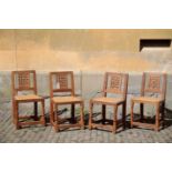 A SET OF FOUR CARVED OAK SIDE CHAIRS BY ROBERT 'MOUSEMAN' THOMPSON,