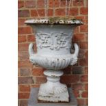 A VICTORIAN PAINTED CAST IRON TWIN HANDLED GARDEN URN,