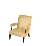 A VICTORIAN UPHOLSTERED ARMCHAIR, IN THE MANNER OF GILLOWS,