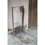 A WROUGHT IRON COUNTRY HOUSE MECHANICAL BOOT CLEANER,