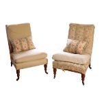A MATCHED PAIR OF VICTORIAN UPHOLSTERED LOW CHAIRS, BY HOWARD & SONS,