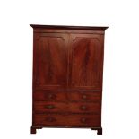 A LATE GEORGE III MAHOGANY LINEN PRESS,