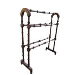 A VICTORIAN WALNUT DRYING HORSE,