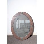 A VICTORIAN PLANISHED COPPER AND TURQUOISE ENAMEL INSET OVAL WALL MIRROR, IN ARTS AND CRAFTS...