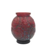 A FRENCH ART DECO MOULDED RED GLASS VASE, BY PIERRE D'AVESN,