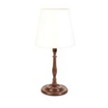A TURNED AND STAINED MAHOGANY TABLE LAMP, IN THE FORM OF A GEORGE III CANDLESTICK,