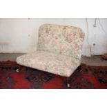 A VICTORIAN MAHOGANY AND UPHOLSTERED TWO SEAT LOW SOFA,