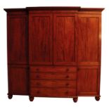 A LATE GEORGE III OR REGENCY MAHOGANY BREAKFRONT WARDROBE, ATTRIBUTABLE TO GILLOWS,