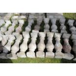 A RUN OF STONE COMPOSITION BALUSTRADING,