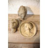 A STONE COMPOSITION MODEL OF THE HEAD OF A WOMAN,