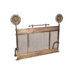 A VICTORIAN GILT BRASS AND LATTICED METAL MESH SPARK GUARD, IN AESTHETIC STYLE, IN THE MANNER...