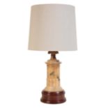 AN ALABASTER AND STAINED HARDWOOD MOUNTED TABLE LAMP,