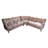 AN UPHOLSTERED CORNER SOFA, BY HOWARD CHAIRS LTD.,