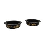 A PAIR OF REGENCY PARCEL GILT BLACK PAPIER MACHE COASTERS,