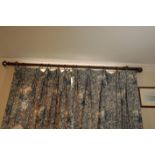 A BRASS CURTAIN POLE,