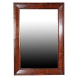 A PAIR OF WALNUT VENEERED RECTANGULAR WALL MIRRORS,