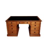 A REGENCY OAK PEDESTAL PARTNERS' DESK, ALMOST CERTAINLY BY GILLOWS,