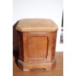 A VICTORIAN OAK AND UPHOLSTERED OTTOMAN STOOL, IN THE MANNER OF HOWARD & SONS,