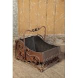 A LATE VICTORIAN WROUGHT IRON AND COPPER FITTED COAL SCUTTLE, IN AESTHETIC STYLE
