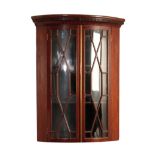 A GEORGE III MAHOGANY AND GLAZED HANGING CORNER CABINET,