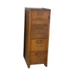 AN OAK FILING CABINET,