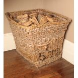 A LARGE WICKER LOG BIN,