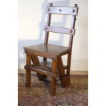 A VICTORIAN OAK METAMORPHIC LIBRARY CHAIR /STEPS, IN REFORMED GOTHIC STYLE, IN THE MANNER OF...