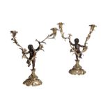 A PAIR OF CONTINENTAL GILT AND PATINATED BRONZE TWIN LIGHT FIGURAL CANDELABRA,