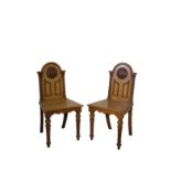 A PAIR OF GEORGE IV OAK HALL CHAIRS, BY T.H. FILMER & SONS,