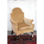 A WALNUT AND UPHOLSTERED ARMCHAIR IN QUEEN ANNE STYLE,