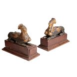 A PAIR OF CARVED AND POLYCHROME PAINTED MODELS OF RECUMBENT SPHINX,