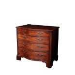 A GEORGE III MAHOGANY SERPENTINE CHEST OF DRAWERS,