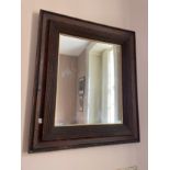 AN OAK FRAMED RECTANGULAR WALL MIRROR,