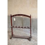 A VICTORIAN MAHOGANY FLOOR STANDING WHIP RACK,