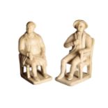 A PAIR OF VICTORIAN PLASTER FIGURAL BOOKENDS,