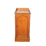 A VICTORIAN OAK BEDSIDE CUPBOARD IN GOTHIC STYLE, POSSIBLY IRISH,