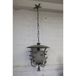 A COPPER AND GLASS HANGING LANTERN,