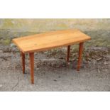 NEIL MORRIS FOR MORRIS OF GLASGOW; A COIN INSET HARDWOOD AND LAMINATE COFFEE TABLE,