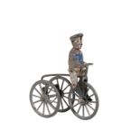 A c.1900 TOY TRICYCLE WITH TINPLATE RIDER