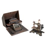 A GERMAN TINPLATE 'U.S.A. PATENTE' CHILDS TYPEWRITING MACHINE TOY