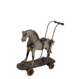 A VICTORIAN WOODEN PUSH-ALONG HORSE TOY