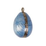 A FABERGE STYLE ENAMELED EGG PENDANT / LOCKET