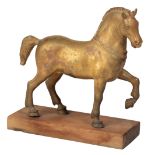 A GILT BRONZE MODEL OF ONE OF THE FOUR HORSES OF ST. MARK'S