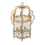 A GILT METAL AND BRASS HALL LANTERN