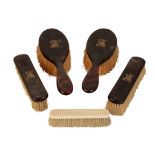 A SET OF FOUR TORTOISESHELL AND MONOGRAMMED GENTLEMANS DRESSING BRUSHES