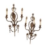 A PAIR OF REGENCY STYLE BRASS THREE LIGHT WALL APPLIQUES