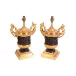 A PAIR OF BRONZE AND GILT METAL TABLE LAMPS IN EMPIRE STYLE